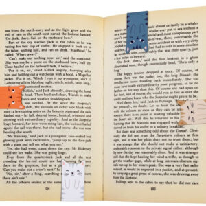 Magnetic Cat Bookmarks on a book