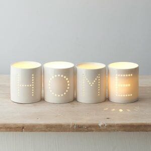 Home dot tea light holders on wooden table