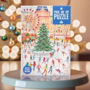 Ice skating Christmas puzzle on a podium with Christmas lights in the background