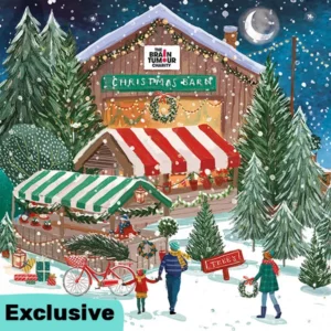 Christmas Barn Charity Christmas Card featuring a festive barn behind a Christmas market and tree lot